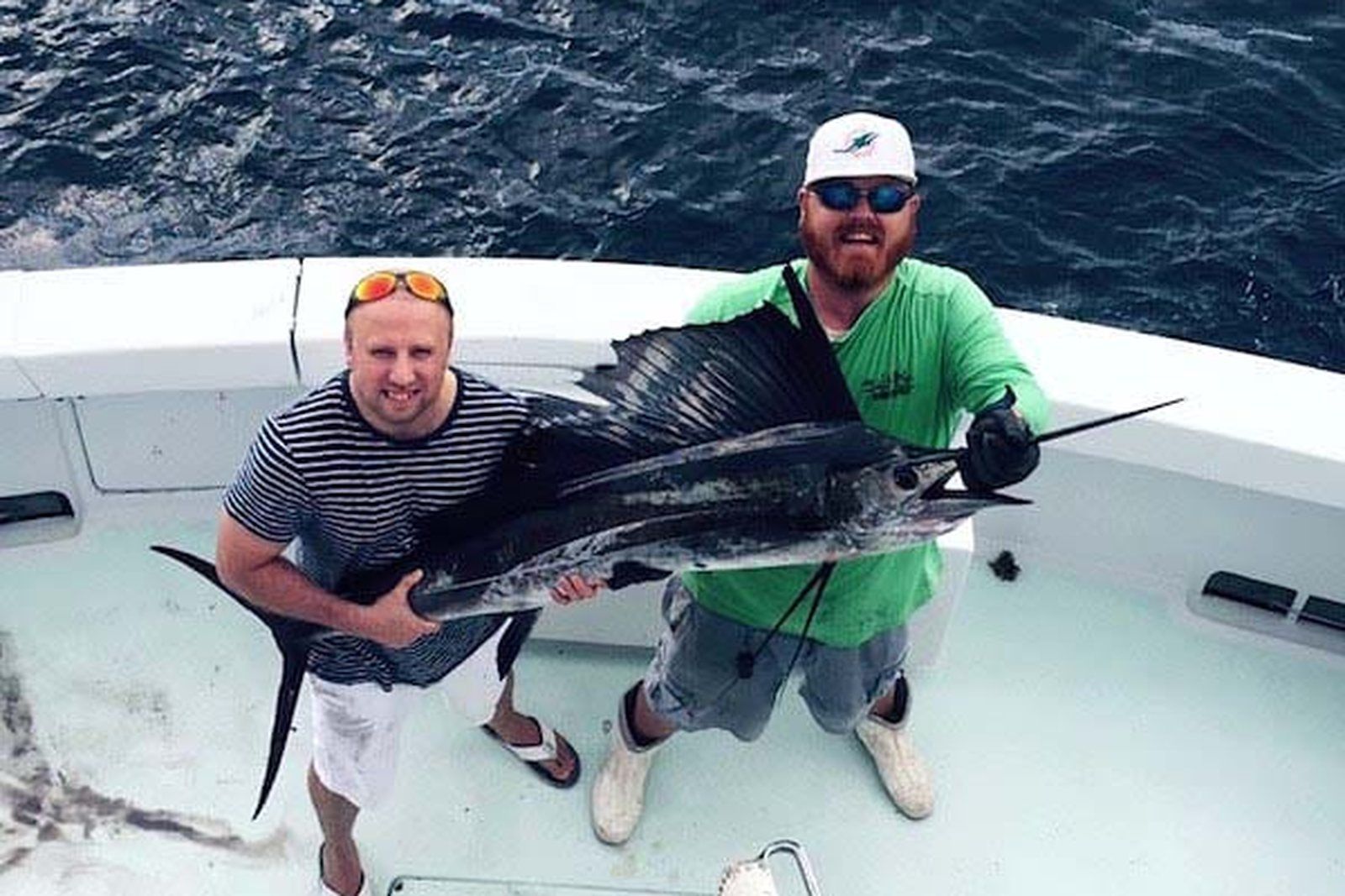 Anglers with a sailfish on a full day charter aboard Spellbound, Miami